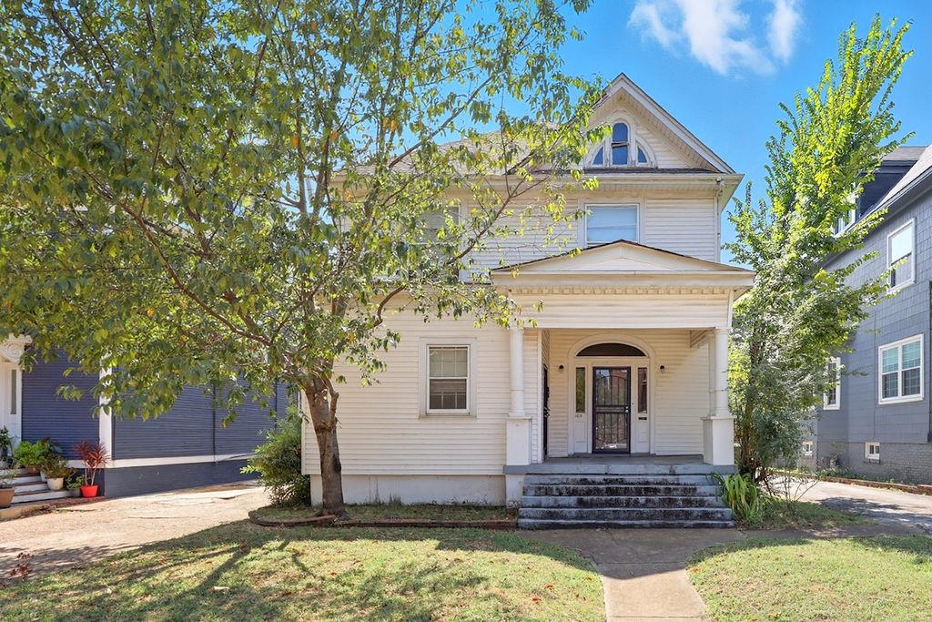 1515 Madison Avenue Memphis, TN 38104 - Photo 2 of 19 a front view of a house with a yard