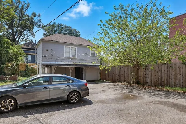 a car parked in front of a house