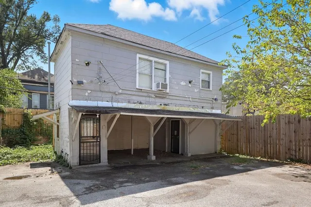 a front view of a house with garage