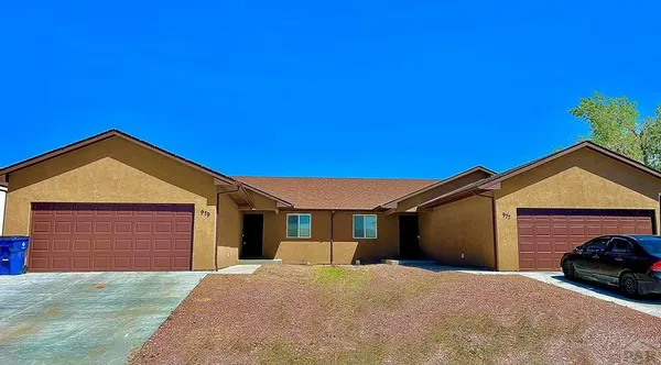 a front view of a house with a garage