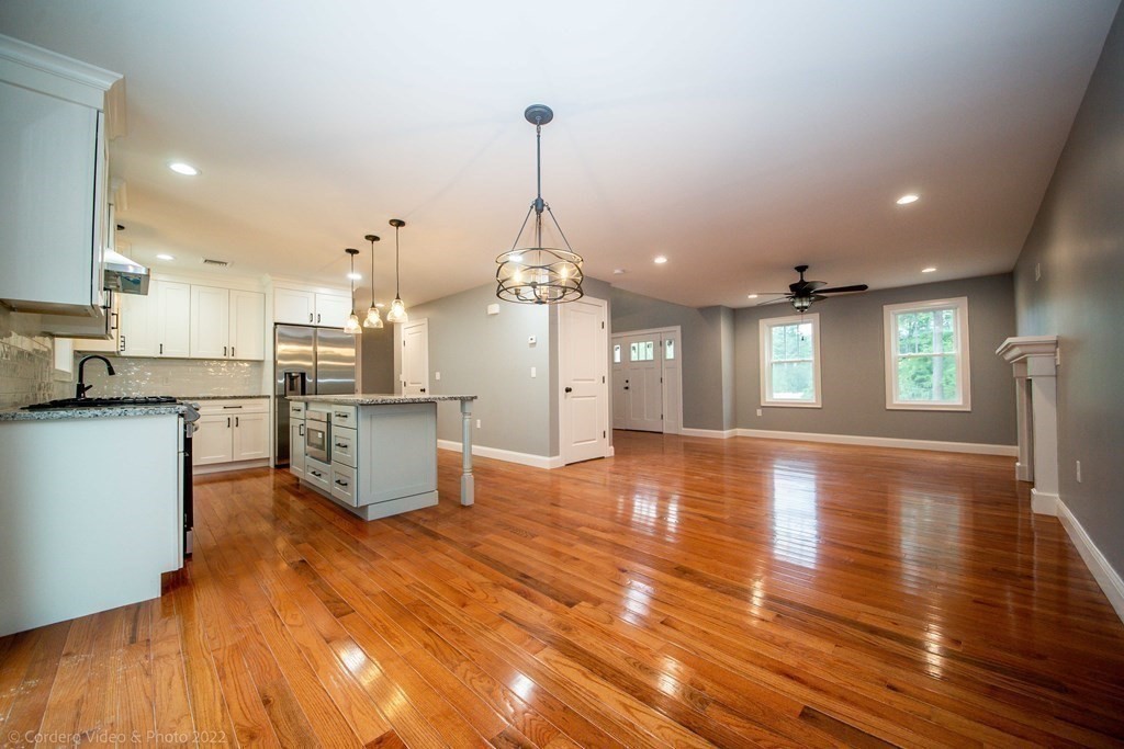 247 Braley Hill Road Rochester, MA 02770 - Photo 3 of 8 a view of a kitchen with cabinets and wooden floor