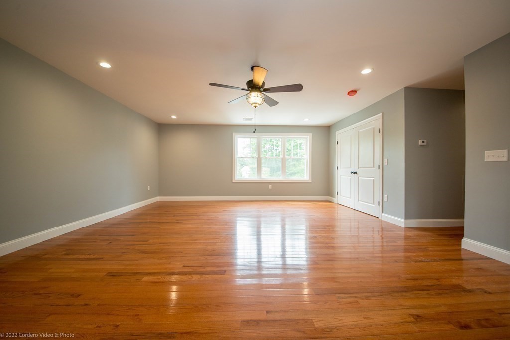 247 Braley Hill Road Rochester, MA 02770 - Photo 8 of 8 a view of empty room with wooden floor and fan