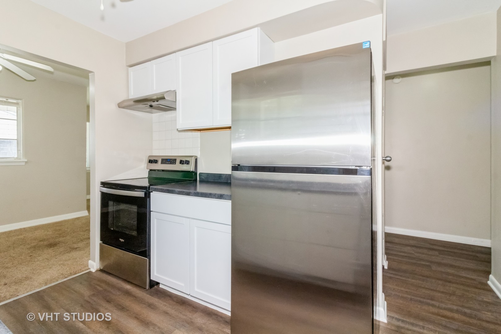 903 North 13th Street DeKalb, IL 60115 - Photo 11 of 19 a kitchen with a refrigerator and a stove