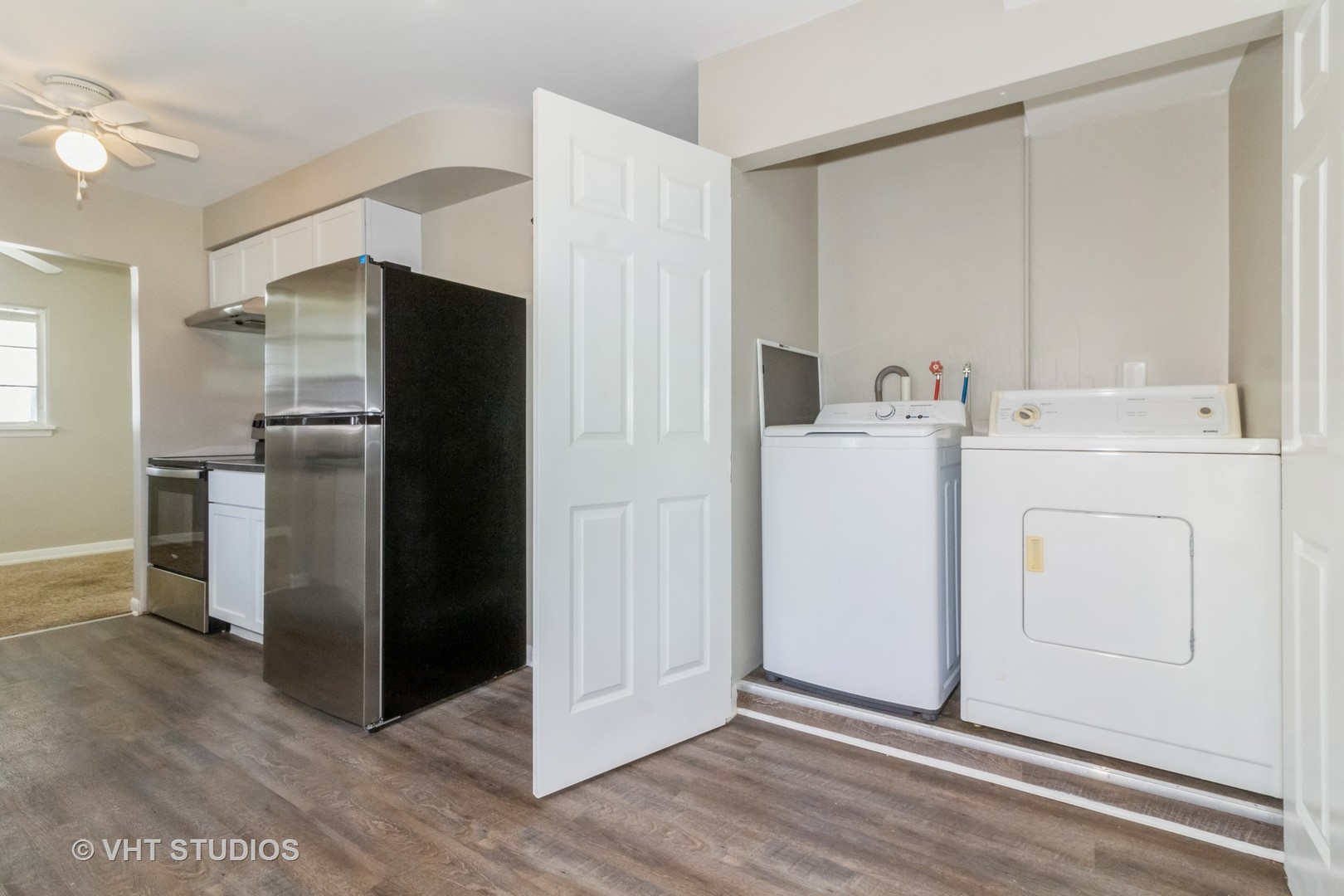 903 North 13th Street DeKalb, IL 60115 - Photo 13 of 19 a view of kitchen with refrigerator and white cabinets