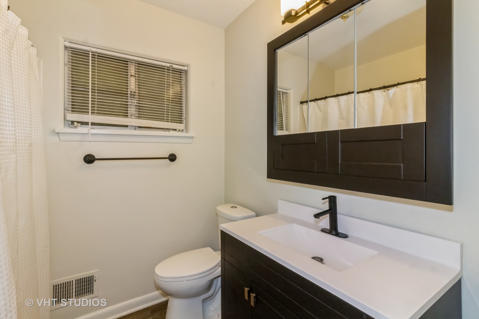 903 North 13th Street DeKalb, IL 60115 - Photo 16 of 19 a bathroom with a sink toilet and shower