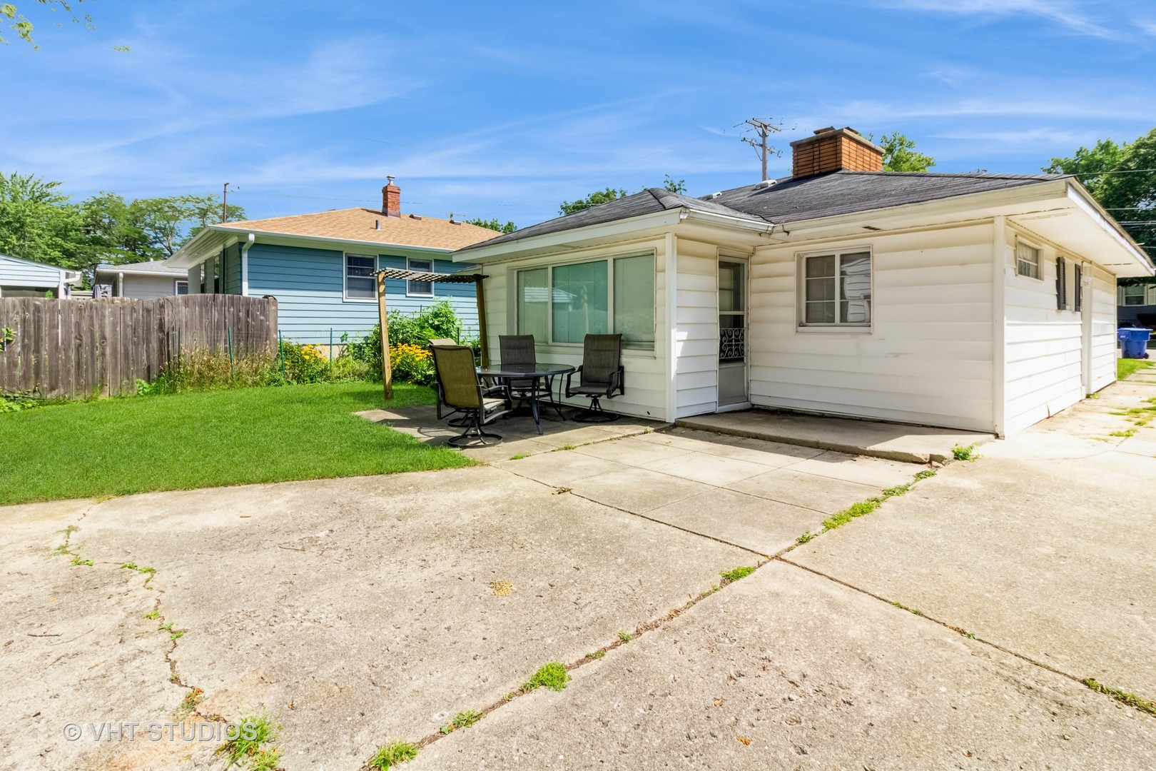 903 North 13th Street DeKalb, IL 60115 - Photo 2 of 19 a front view of a house with a garden and yard