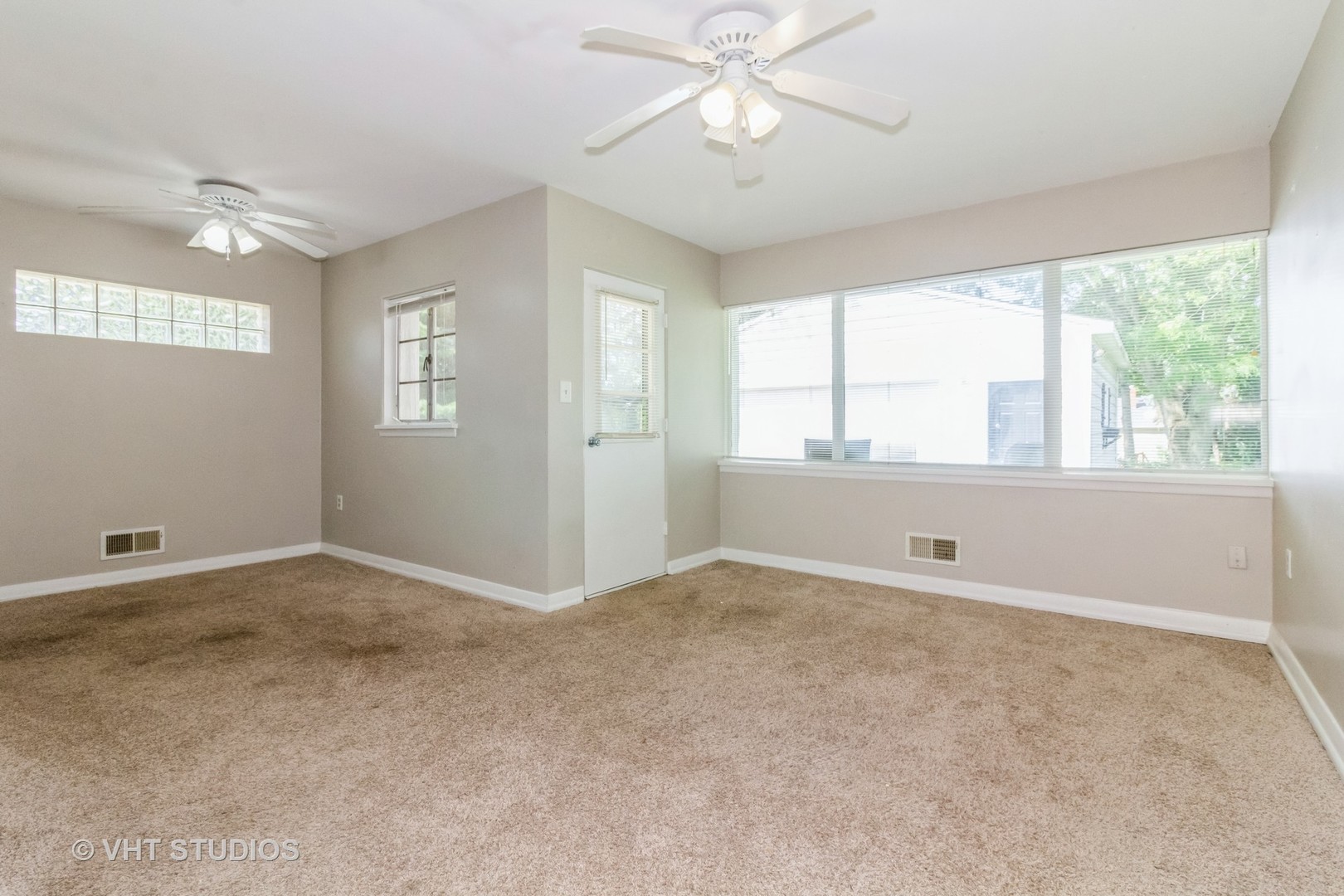 903 North 13th Street DeKalb, IL 60115 - Photo 5 of 19 a view of an empty room with a window