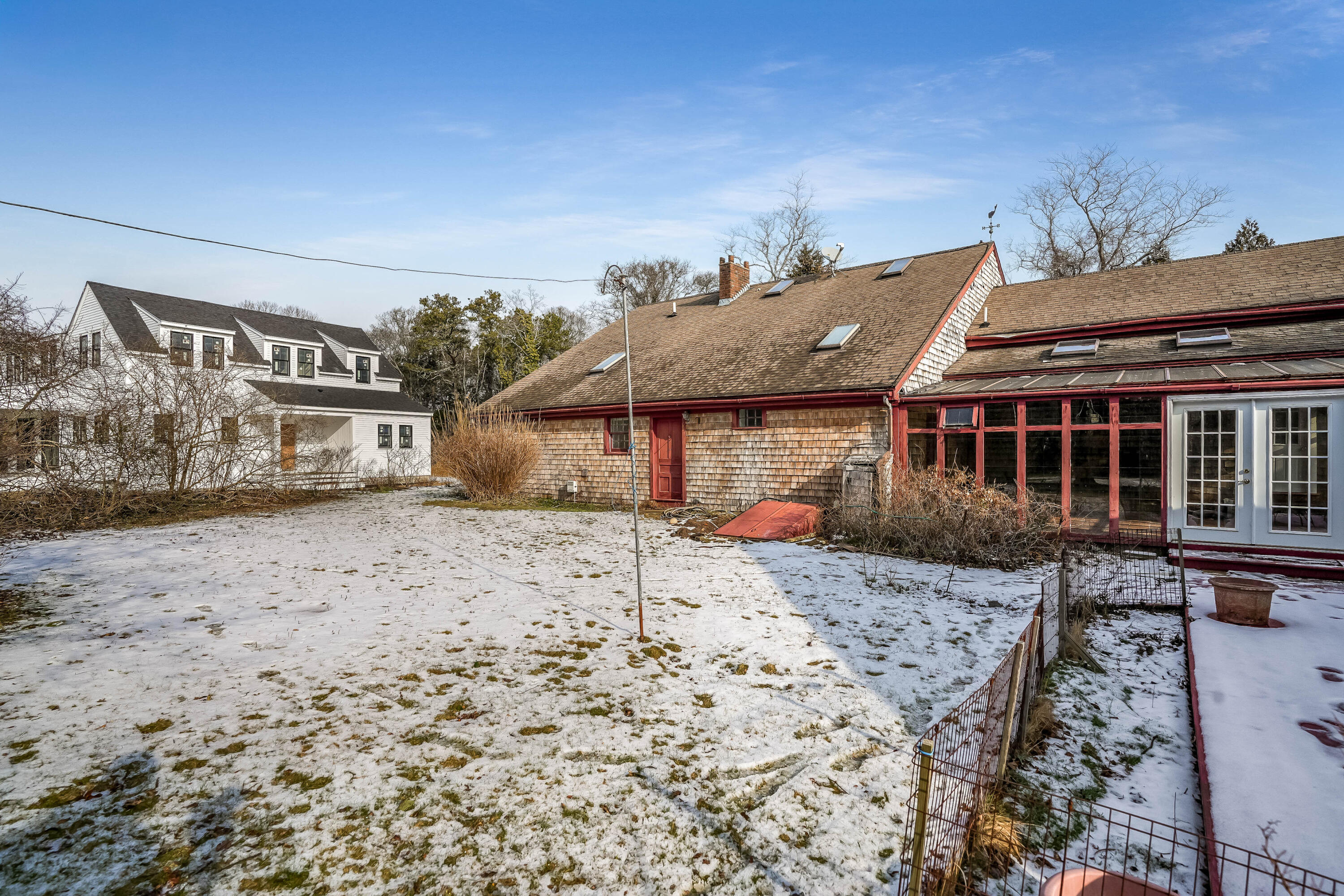 32 Norton Orchard Road Edgartown, MA 02539 - Photo 4 of 26 a front view of a house with a yard