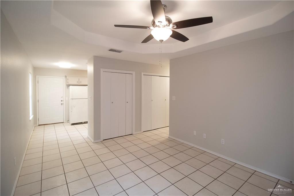 708 Robin Avenue, Unit 3 McAllen, TX 78504 - Photo 2 of 10 an empty room with fan and way to kitchen