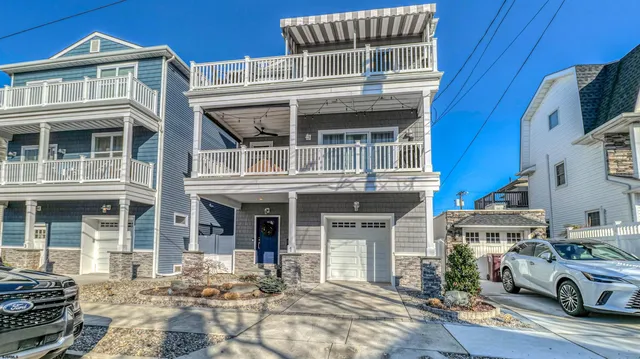 a front view of a house with many windows