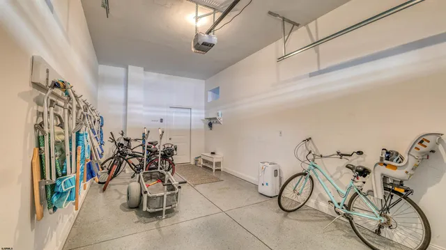 a view of hall with a table and chairs
