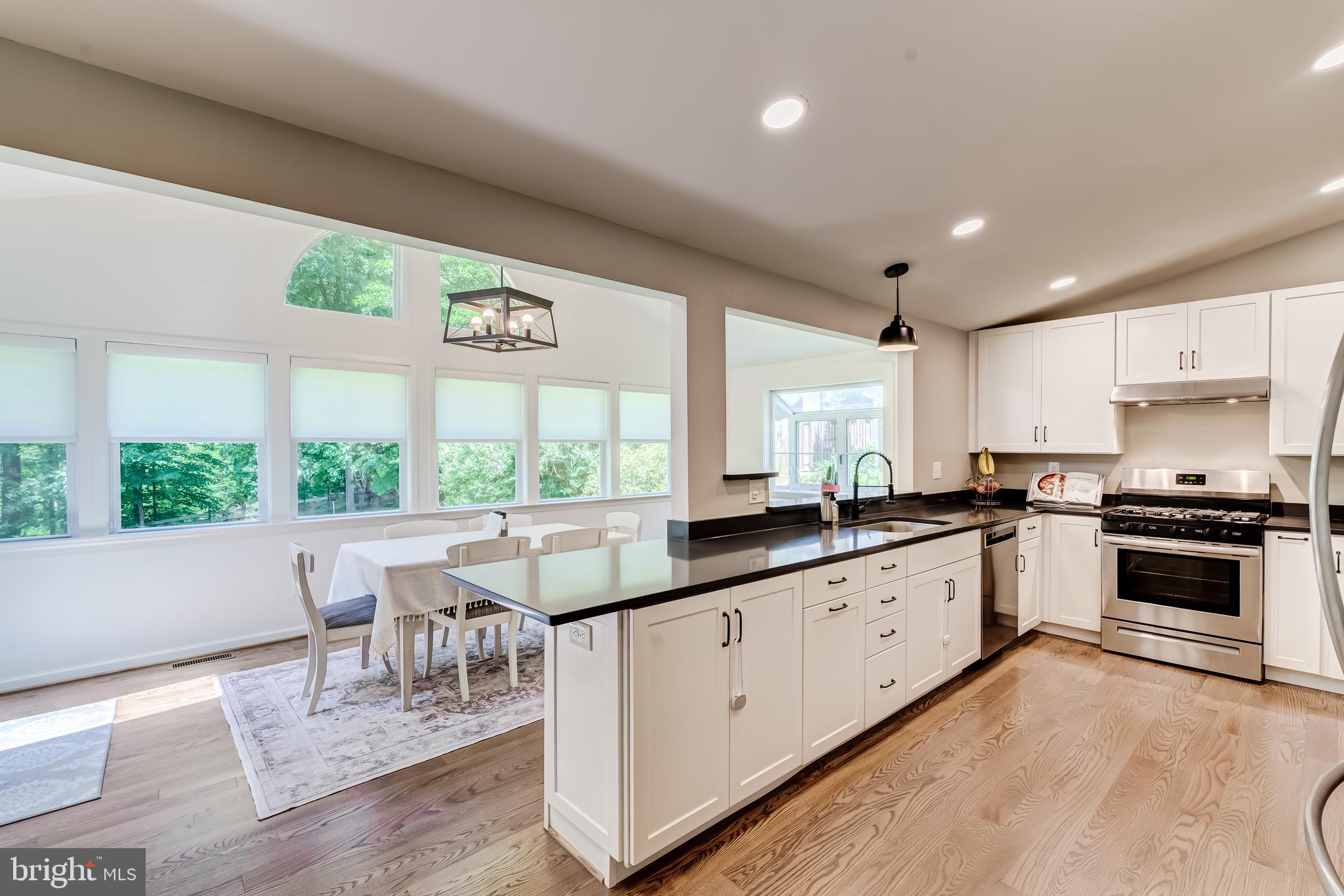 11926 Appling Valley Road Fairfax, VA 22030 - Photo 24 of 60 a large kitchen with lots of counter space and windows