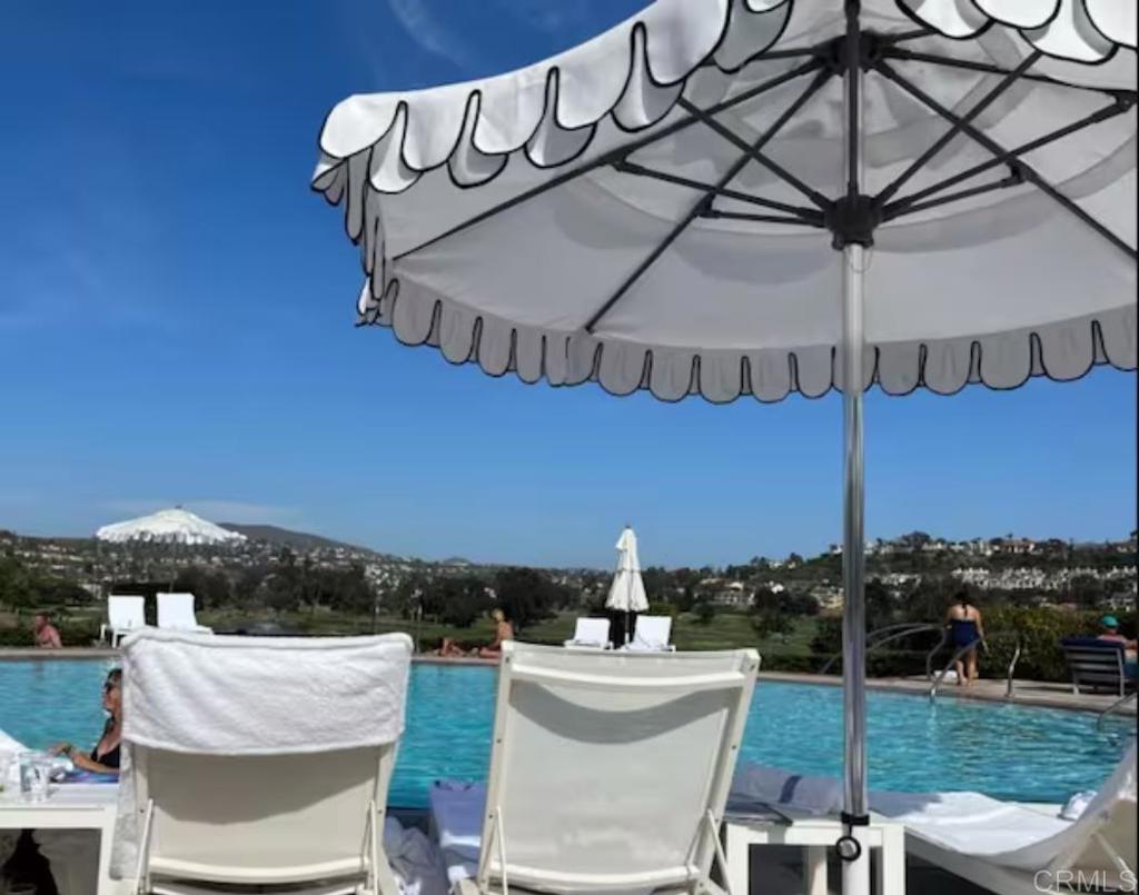 a view of a patio with table and chairs
