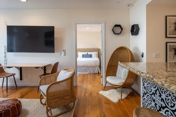 a living room with furniture and a flat screen tv