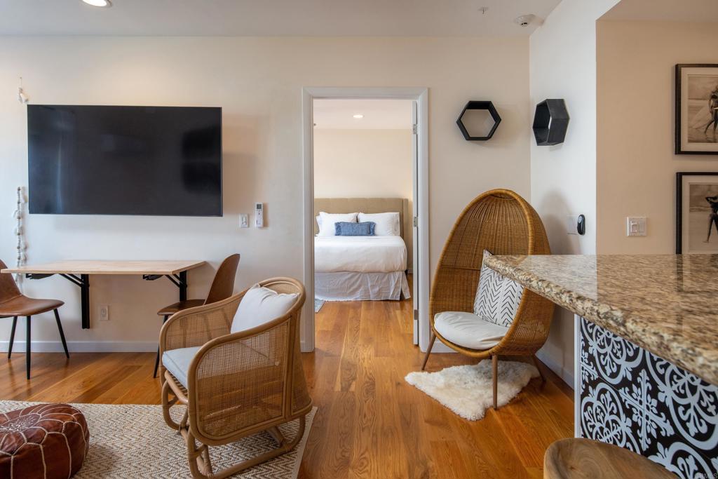 2005 Costa Del Mar Road, Unit 627 Carlsbad, CA 92009 - Photo 13 of 21 a living room with furniture and a flat screen tv