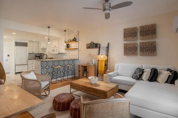 a living room with furniture and a fireplace