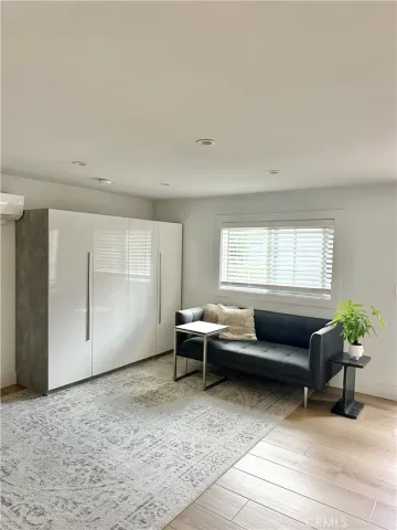 a living room with furniture and windows