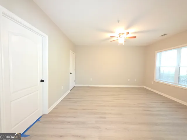 a bathroom with a toilet a sink and bathtub