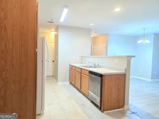 a bathroom with a granite countertop sink mirror and vanity