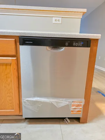 a stove top oven sitting inside of a kitchen