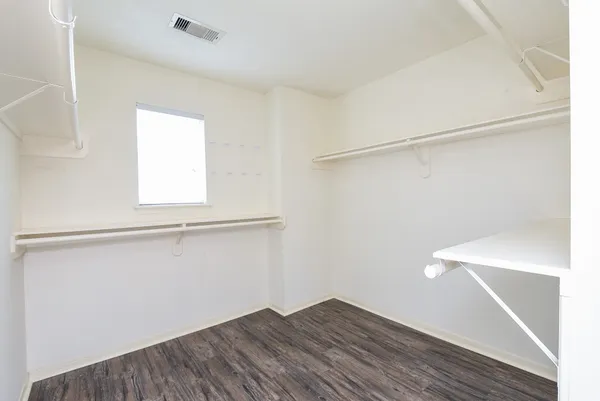 a view of an empty walk in closet