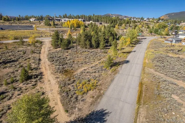 a view of a city with mountains in the background
