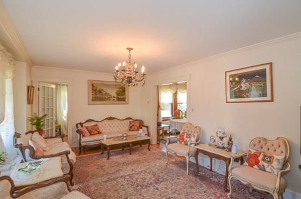 16 Kimball Road Watertown, MA 02472 - Photo 3 of 22 a living room with furniture and a chandelier