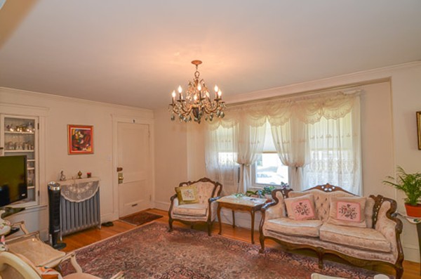16 Kimball Road Watertown, MA 02472 - Photo 4 of 22 a living room with furniture and a chandelier