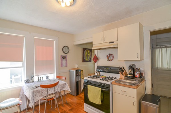16 Kimball Road Watertown, MA 02472 - Photo 7 of 22 a kitchen with stainless steel appliances granite countertop a stove and a refrigerator