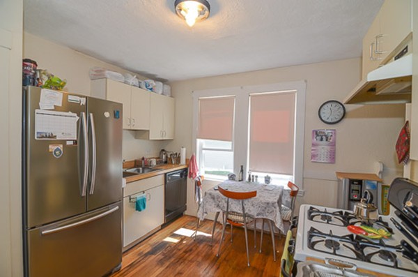 16 Kimball Road Watertown, MA 02472 - Photo 8 of 22 a kitchen with stainless steel appliances a refrigerator and a stove