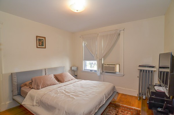 16 Kimball Road Watertown, MA 02472 - Photo 9 of 22 a bedroom with a bed and wooden floor