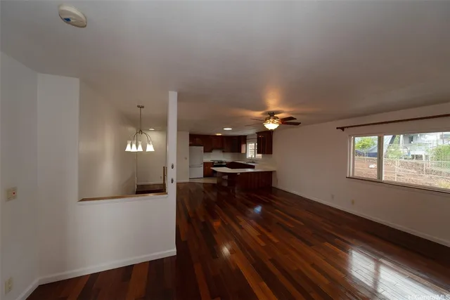 a kitchen with a refrigerator and a stove