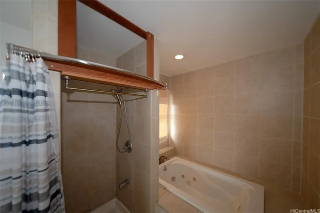 a bathroom with a shower and a sink