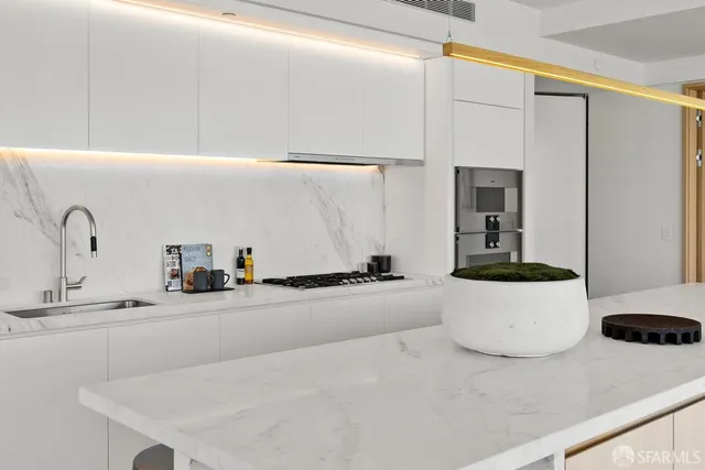 a bathroom with a double vanity sink and a tub