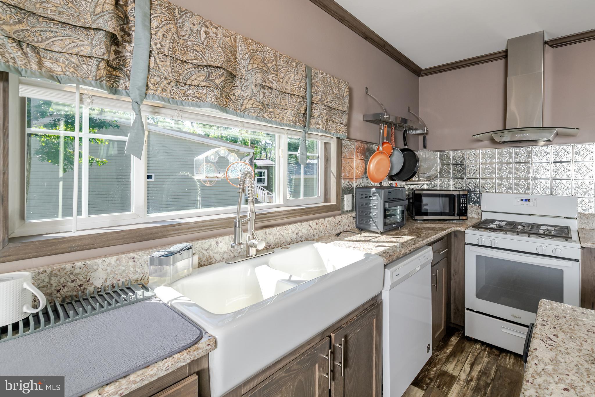 106 East Moss Mill Road, Unit T38 Galloway Township, NJ 08205 - Photo 11 of 28 a kitchen with a sink and stove
