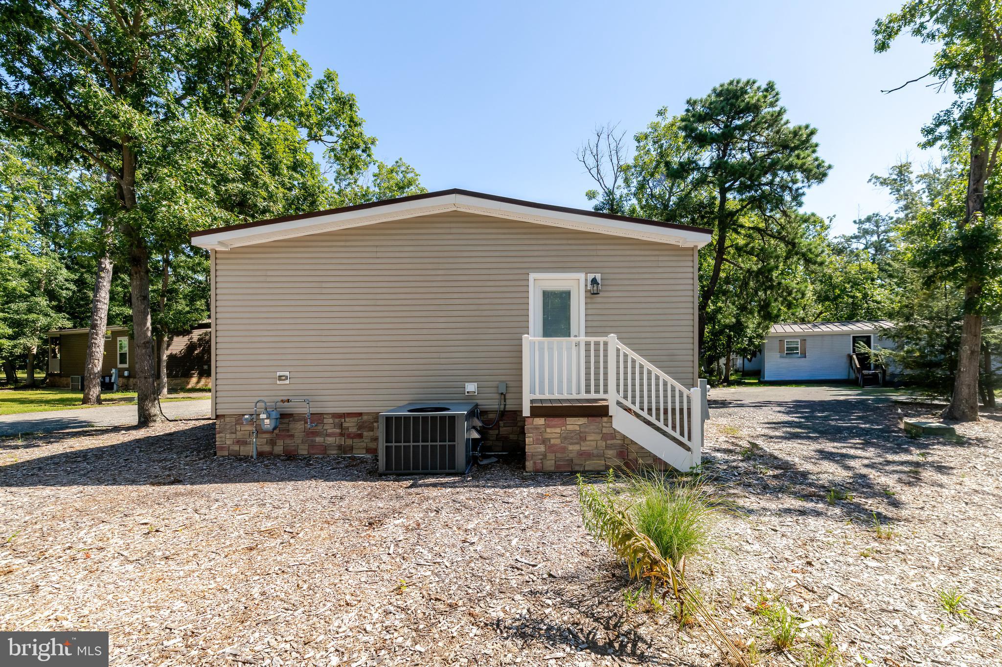 106 East Moss Mill Road, Unit T38 Galloway Township, NJ 08205 - Photo 24 of 28 a front view of a house with a yard