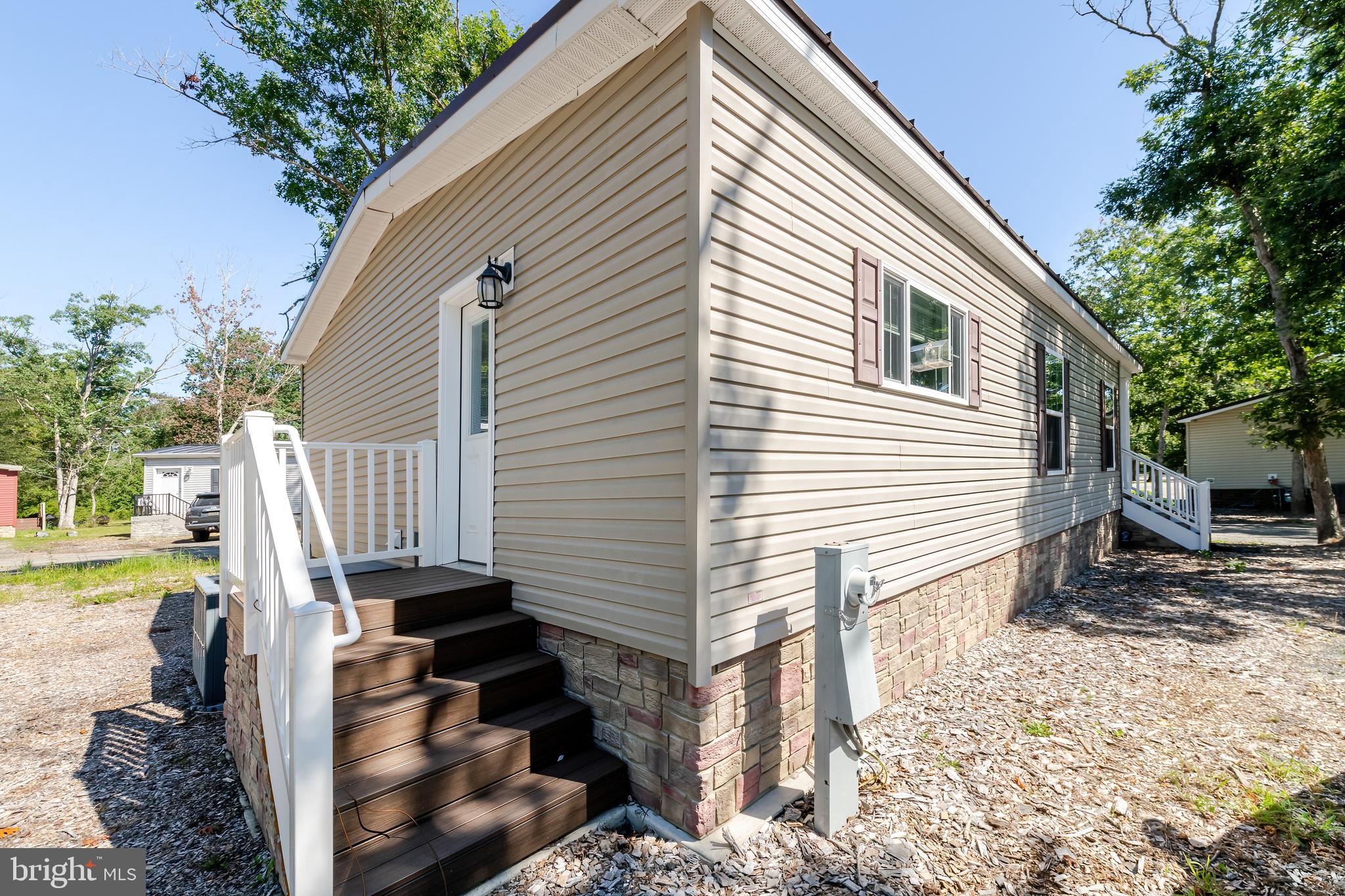 106 East Moss Mill Road, Unit T38 Galloway Township, NJ 08205 - Photo 25 of 28 a view of a house with backyard and sitting area