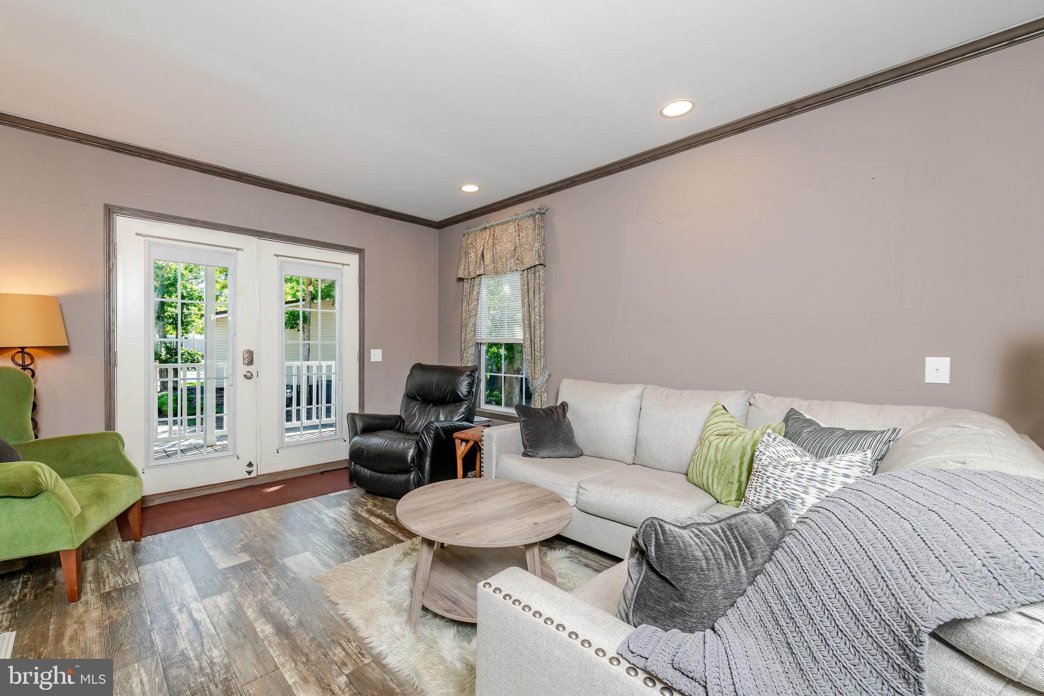 106 East Moss Mill Road, Unit T38 Galloway Township, NJ 08205 - Photo 5 of 28 a living room with furniture and a large window