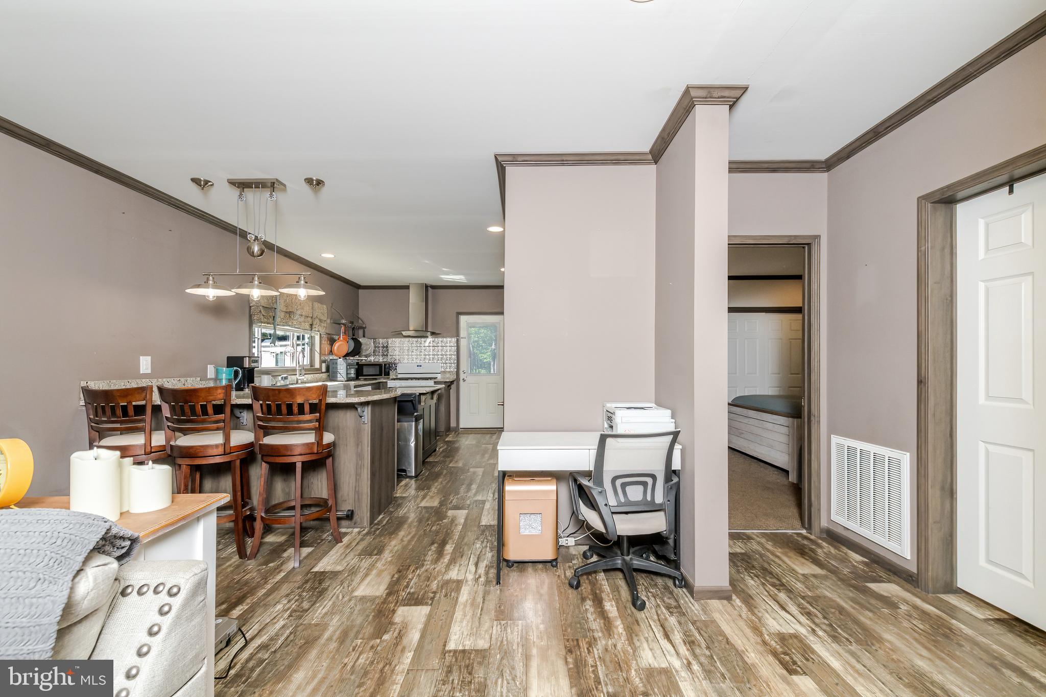 106 East Moss Mill Road, Unit T38 Galloway Township, NJ 08205 - Photo 7 of 28 a room with stainless steel appliances lots of wooden furniture