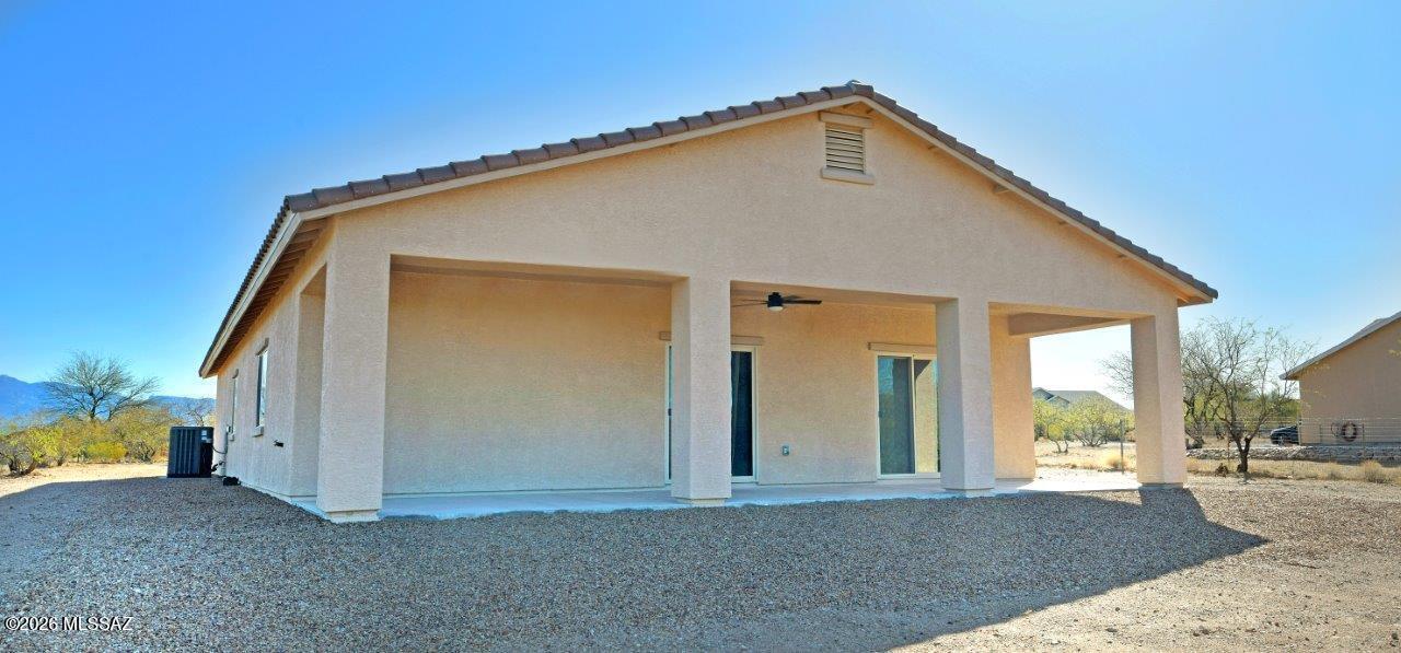 1091 North Vail View Road Vail, AZ 85641 - Photo 38 of 43 a front view of a house with a yard