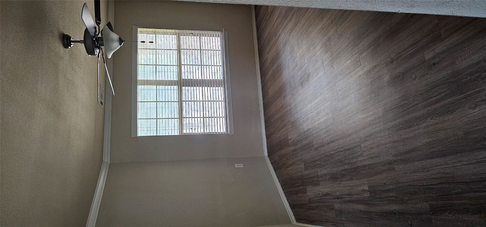 7213 Outfitter Drive Austin, TX 78744 - Photo 13 of 16 wooden floor in an empty room with a window