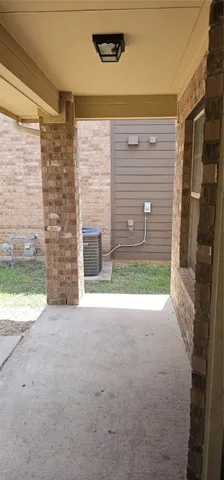 a view of a door of a house with a yard