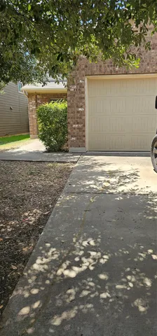 a view of a backyard of the house