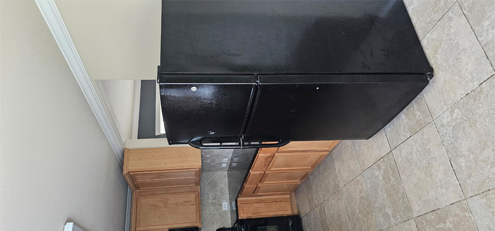 7213 Outfitter Drive Austin, TX 78744 - Photo 10 of 16 a kitchen with a refrigerator and a sink