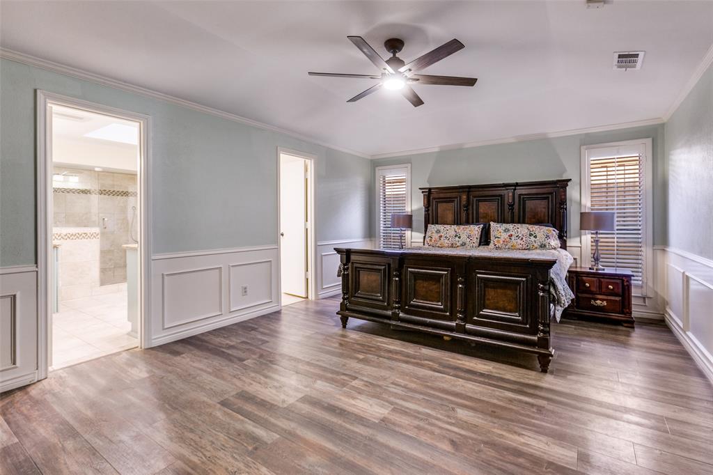 15881 Nedra Way Dallas, TX 75248 - Photo 14 of 26 a bedroom with a bed next to a window with a dresser