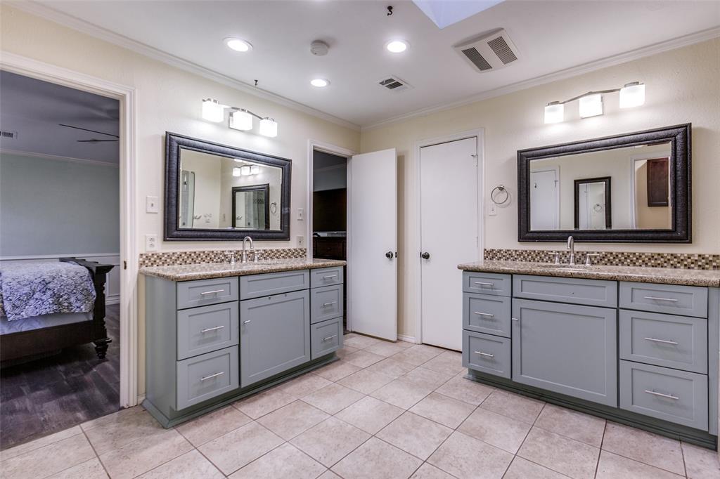 15881 Nedra Way Dallas, TX 75248 - Photo 15 of 26 a bathroom with a granite countertop sink and a mirror