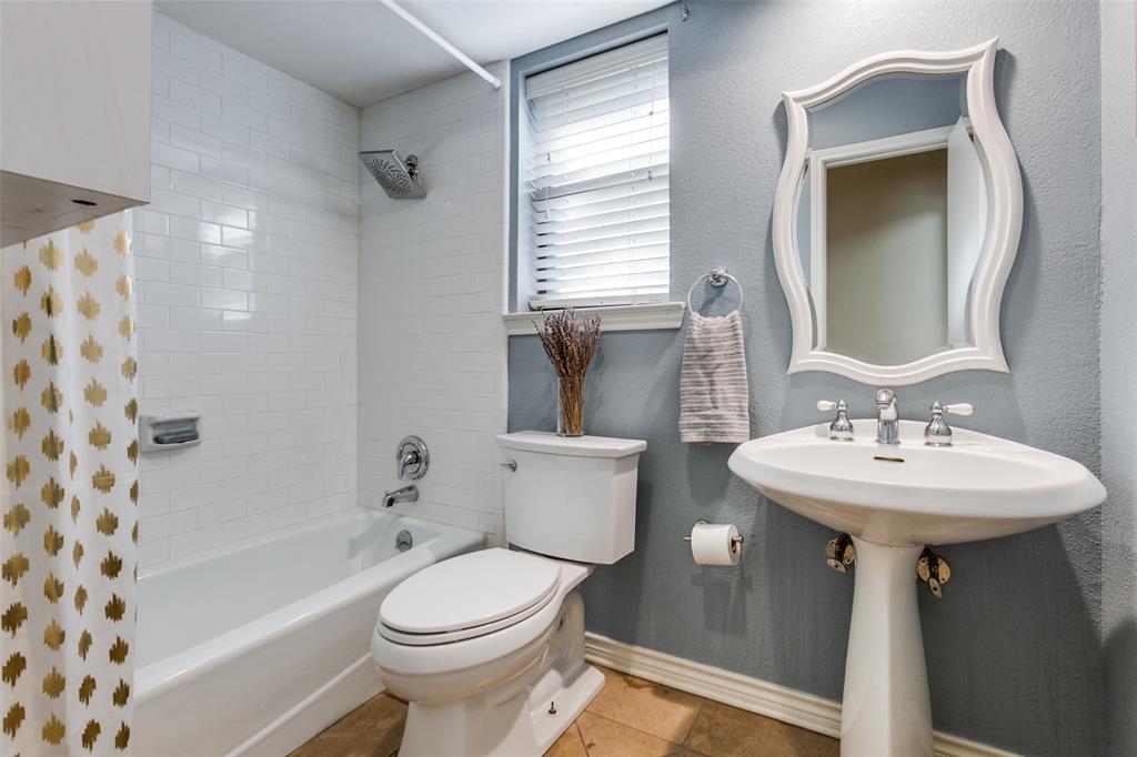 15881 Nedra Way Dallas, TX 75248 - Photo 21 of 26 a bathroom with a sink toilet and shower