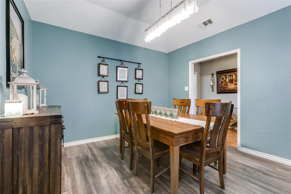 15881 Nedra Way Dallas, TX 75248 - Photo 3 of 26 a view of a dining room with furniture and wooden floor