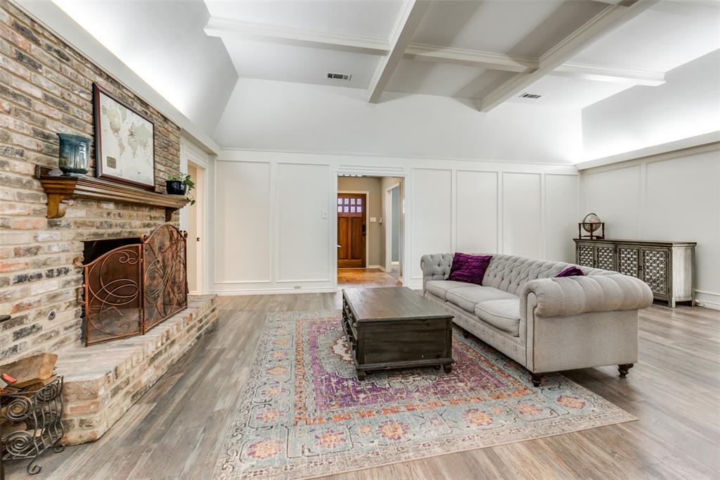 15881 Nedra Way Dallas, TX 75248 - Photo 8 of 26 a living room with furniture and a fireplace