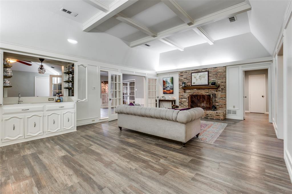15881 Nedra Way Dallas, TX 75248 - Photo 9 of 26 a living room with furniture and a fireplace